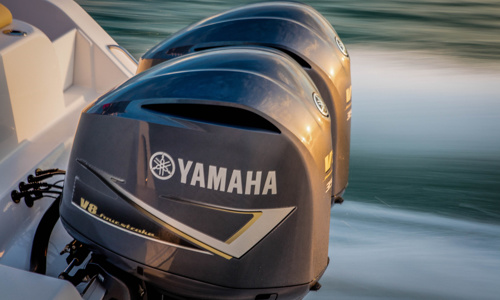 Close-up of two Yamaha® outboard motors in a boat.