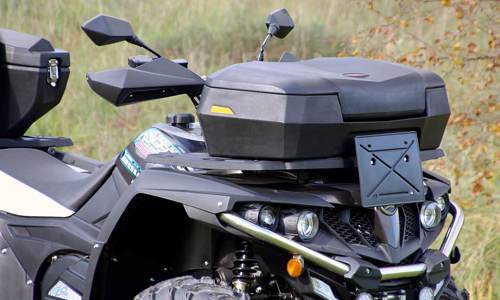 Close-up of an ATV with storage boxes.