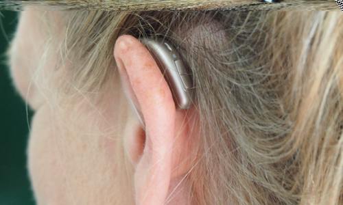 woman wearing a hearing aid